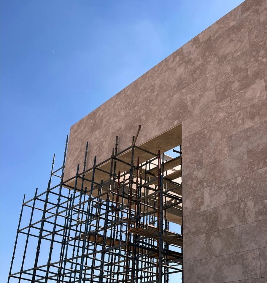 Natural stone cladding on a cantilevered frame